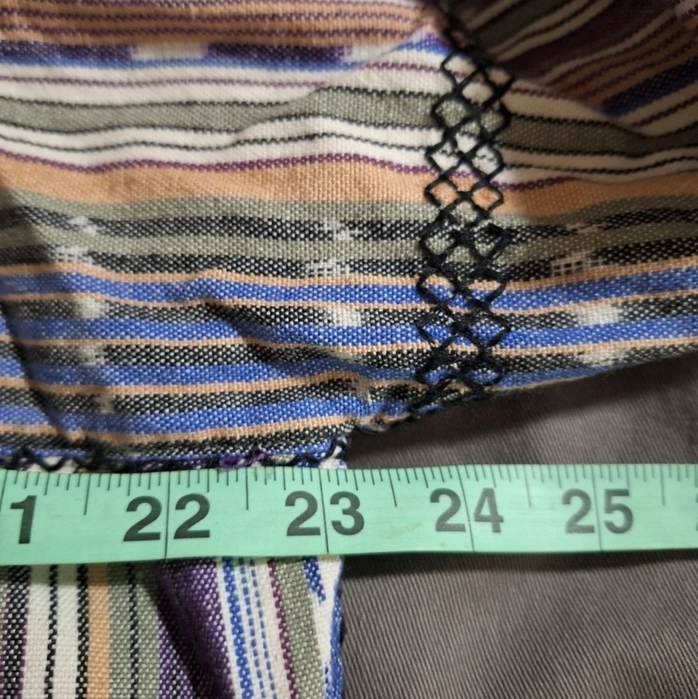 A Free People long sleeve blouse with string ties in the front in a size small.